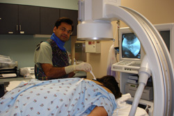 Dr. Bhadresh L. Bhakta, M.D. performing a fluoroscopy-guided interventional pain procedure